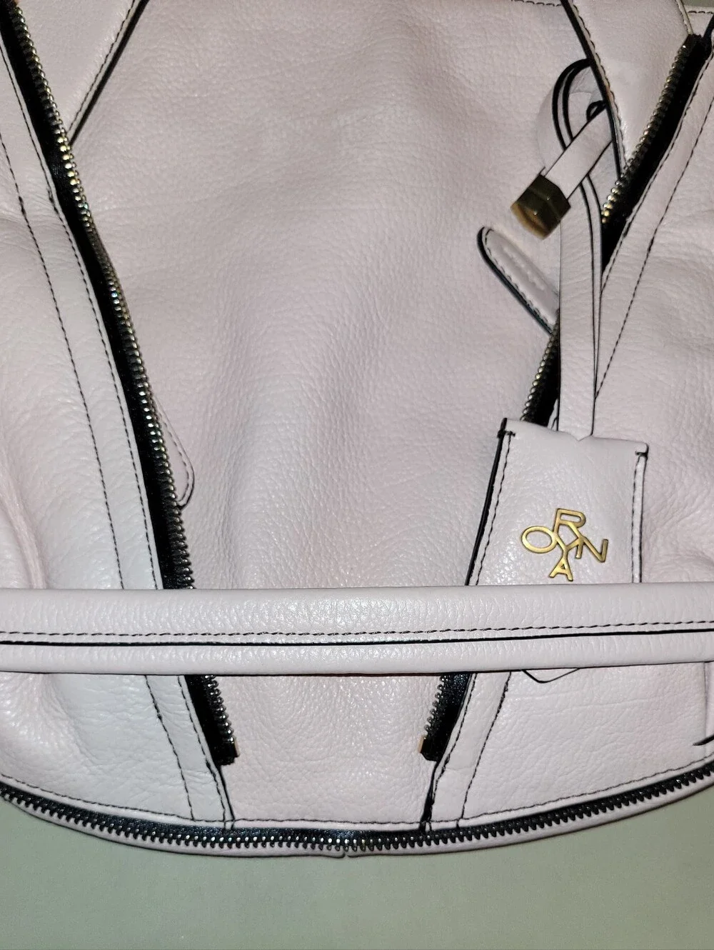 Oryany Blush Leather Shoulder Bag with Gold Turn-Lock Top Zip Bag.